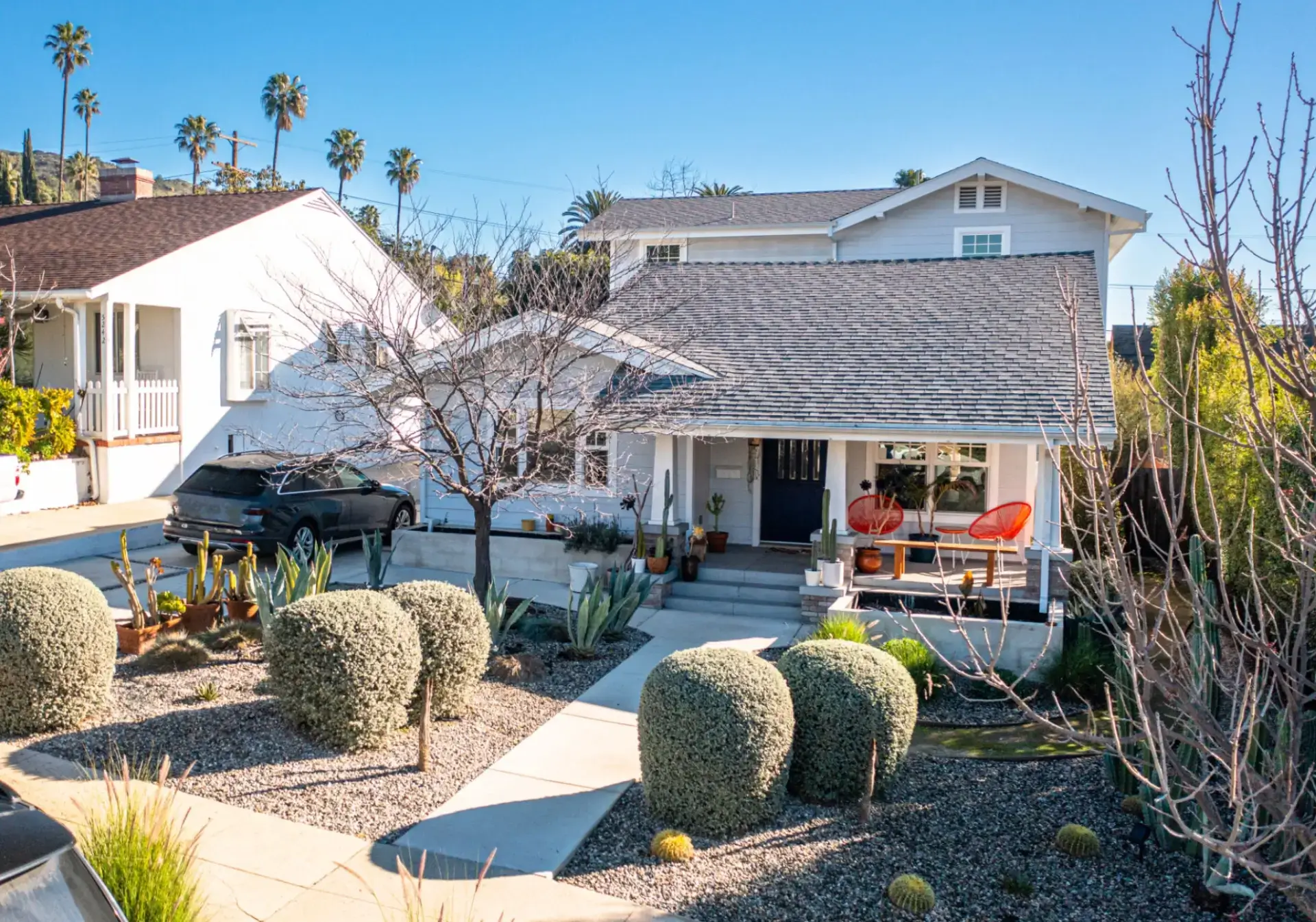Cozy suburban house with landscaped front yard.